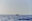 Das Mittelmeer und der Horizont mit einem kleinen Boot in der Ferne.