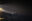 Humanity 1 strahlt auf Boot mit Flüchtenden in der Nacht